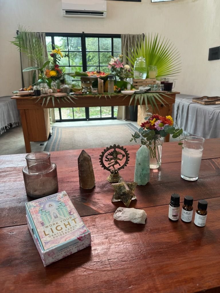 Altar with crystals, essential oils and oracle cards at Rancho Verde Tulum