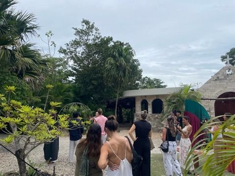 Wedding guests on the chapel grounds at Rancho Verde Tulum